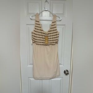 Ivory dress with gold accents in front from Francesca’s